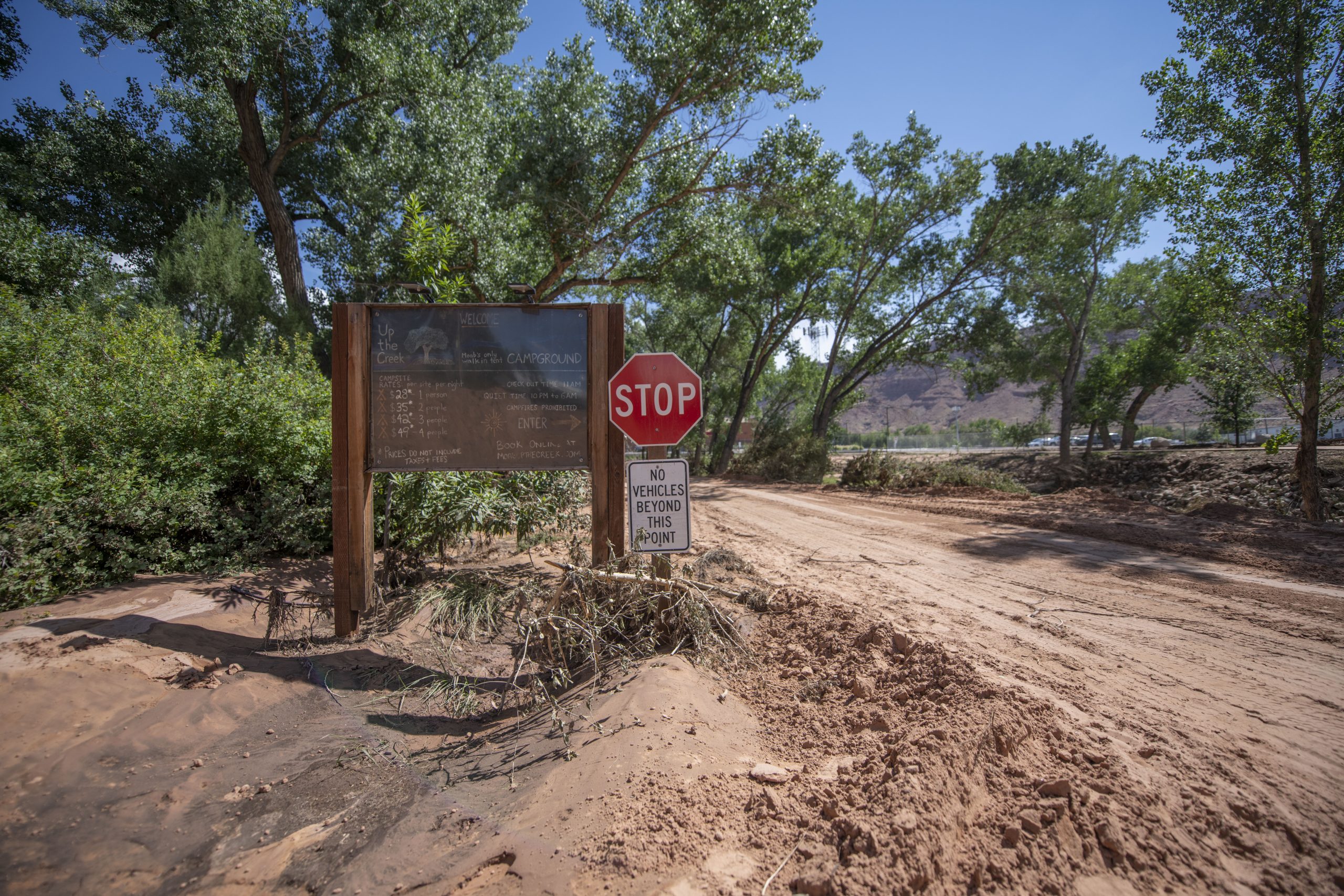 The entrance to the campground is now covered in mud and debris.