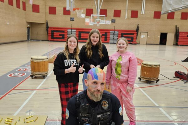 Officer Pratt with Edyn Rhoades, Paige Frandsen, and Bailey O'Reilly. [Courtesy Photo]