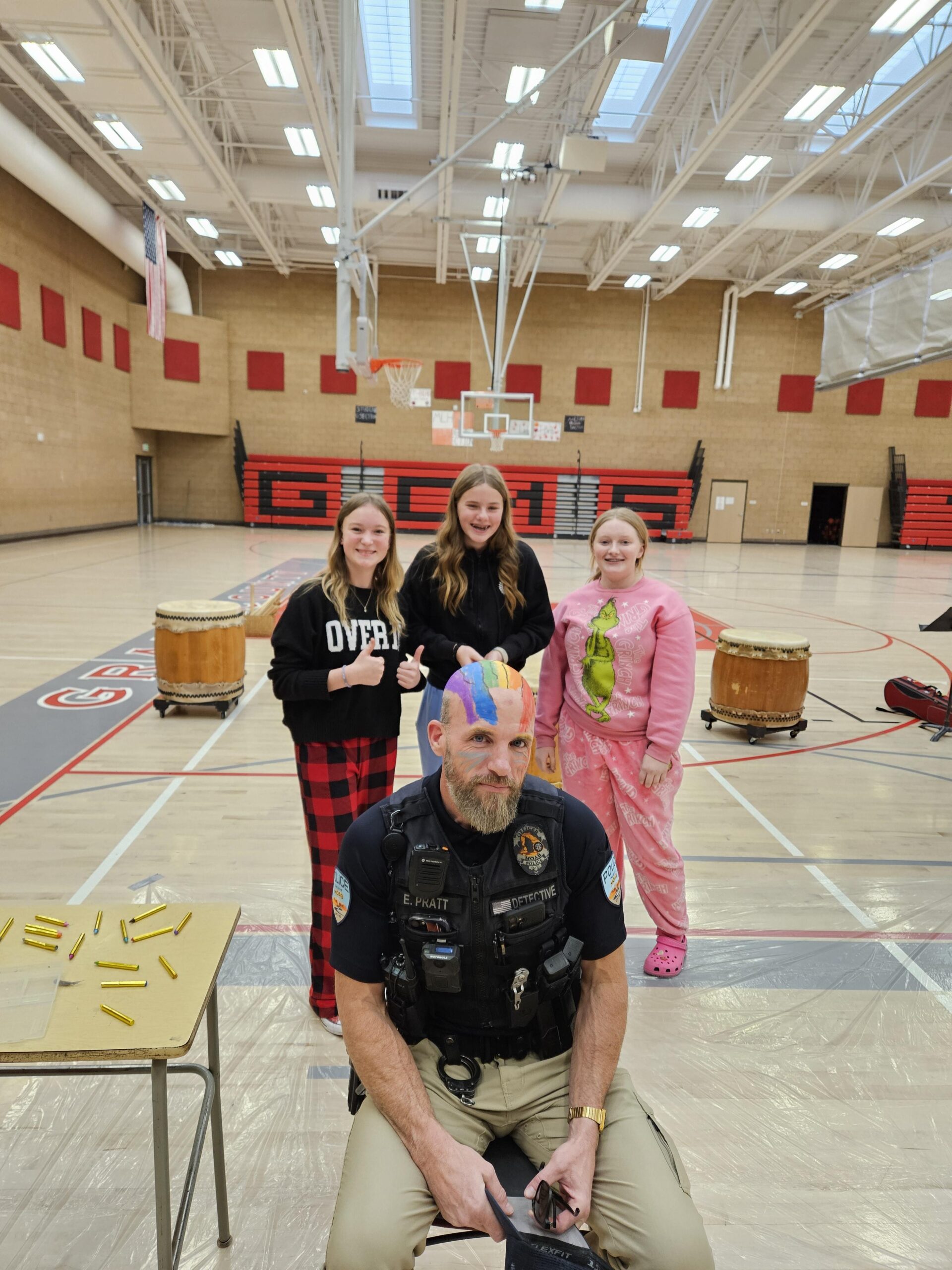 Officer Pratt with Edyn Rhoades, Paige Frandsen, and Bailey O'Reilly. [Courtesy Photo]