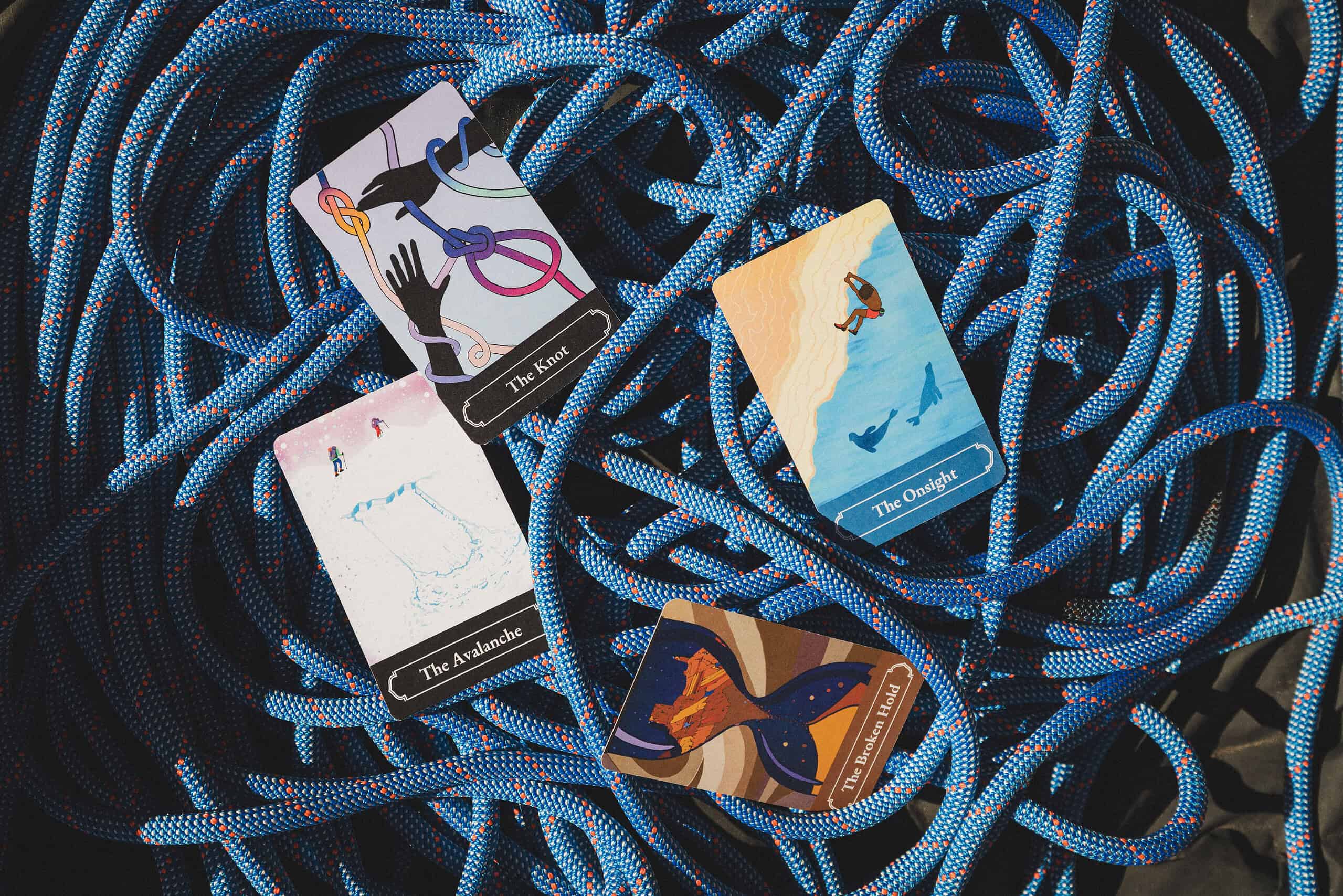 Skybound Traveler Deck Colorful cards titled The Knot, The Onsight, The Avalanche, and The Broken Hold on coiled blue rope.