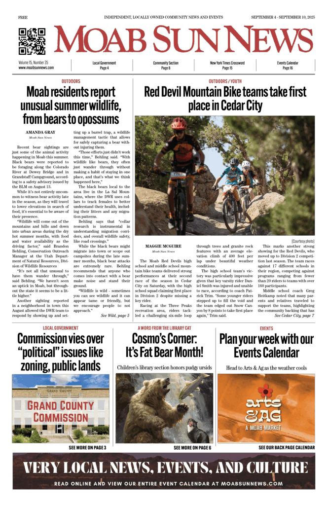 Cyclists navigate rocky trail in Moab, featured in Moab Sun News. Read more about local culture and events.