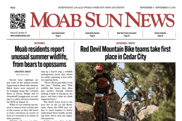 Cyclists navigate rocky trail in Moab, featured in Moab Sun News. Read more about local culture and events.