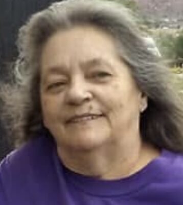 Person with long gray hair Amber Sargent