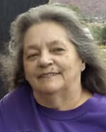 Person with long gray hair Amber Sargent