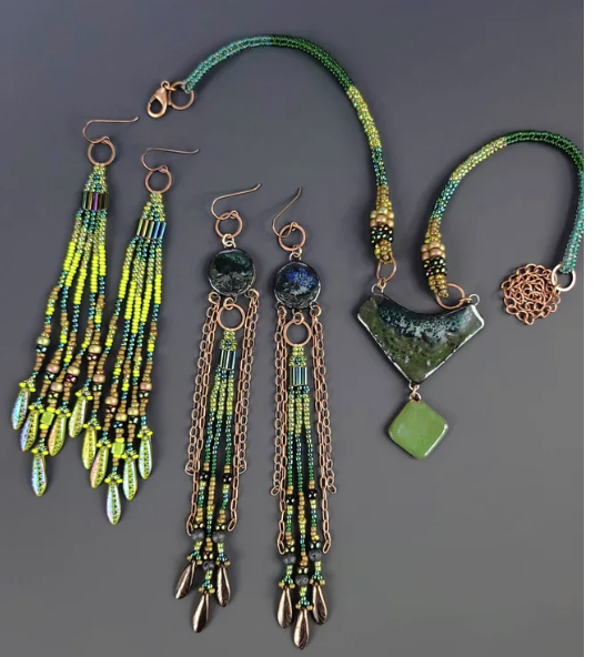 Desert Edge Designs Handmade beaded jewelry set with green and bronze tones, featuring earrings and a matching necklace on a gray background.