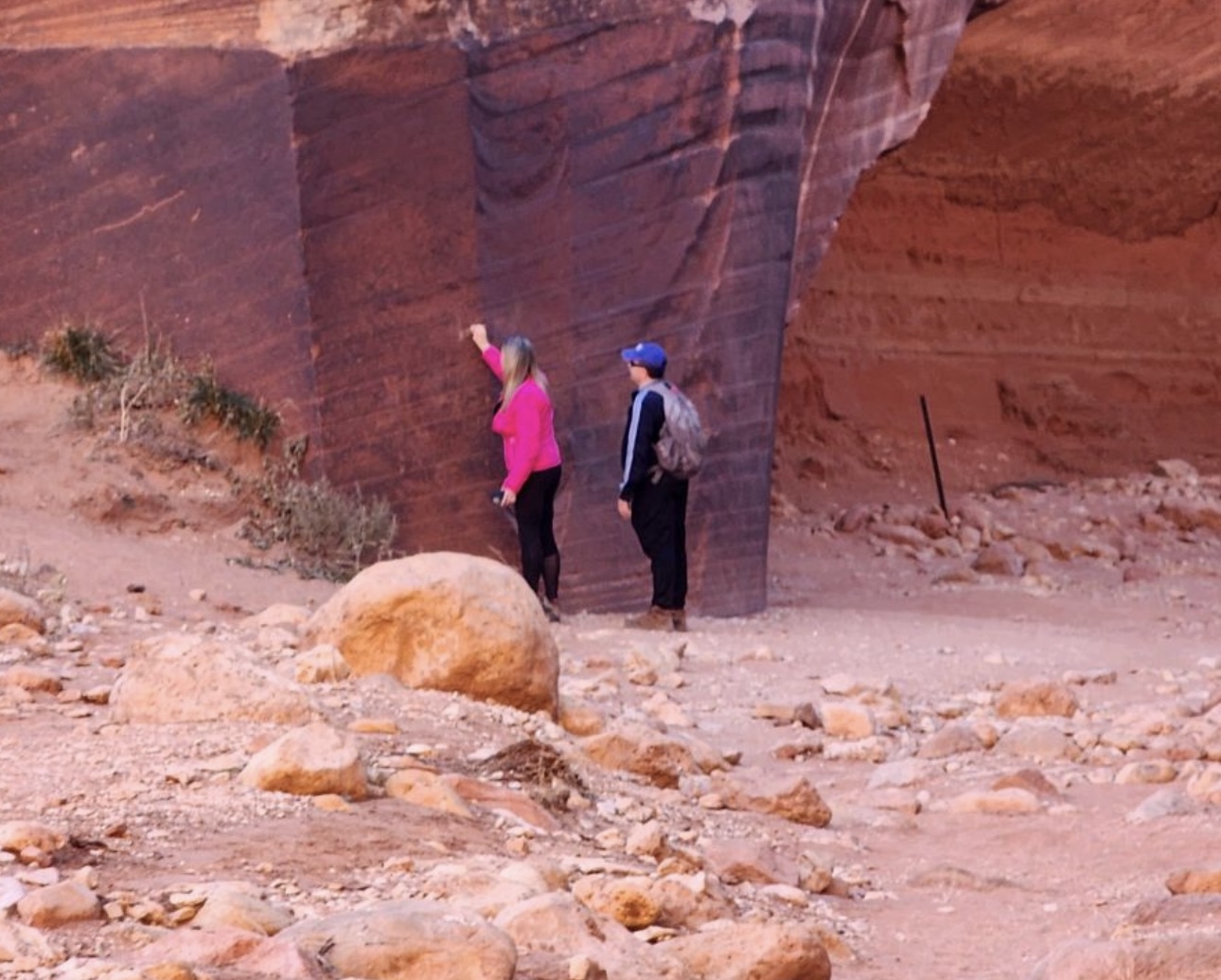 Hikers defacing a rock art panel in Kane County 2024